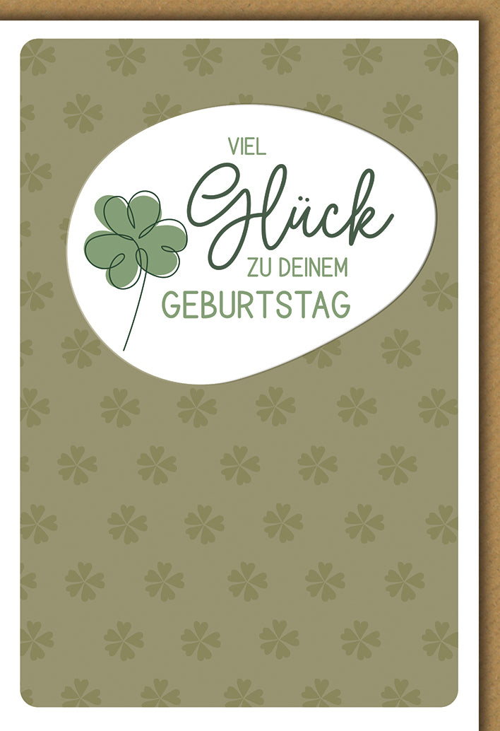 Geburtstagskarte Glücksbringer: Grünes Kleeblatt auf eleganter Kleeblattmusterung